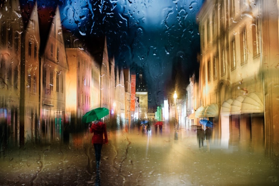 colourful composite of a street scene taken through a window on a rainy day.