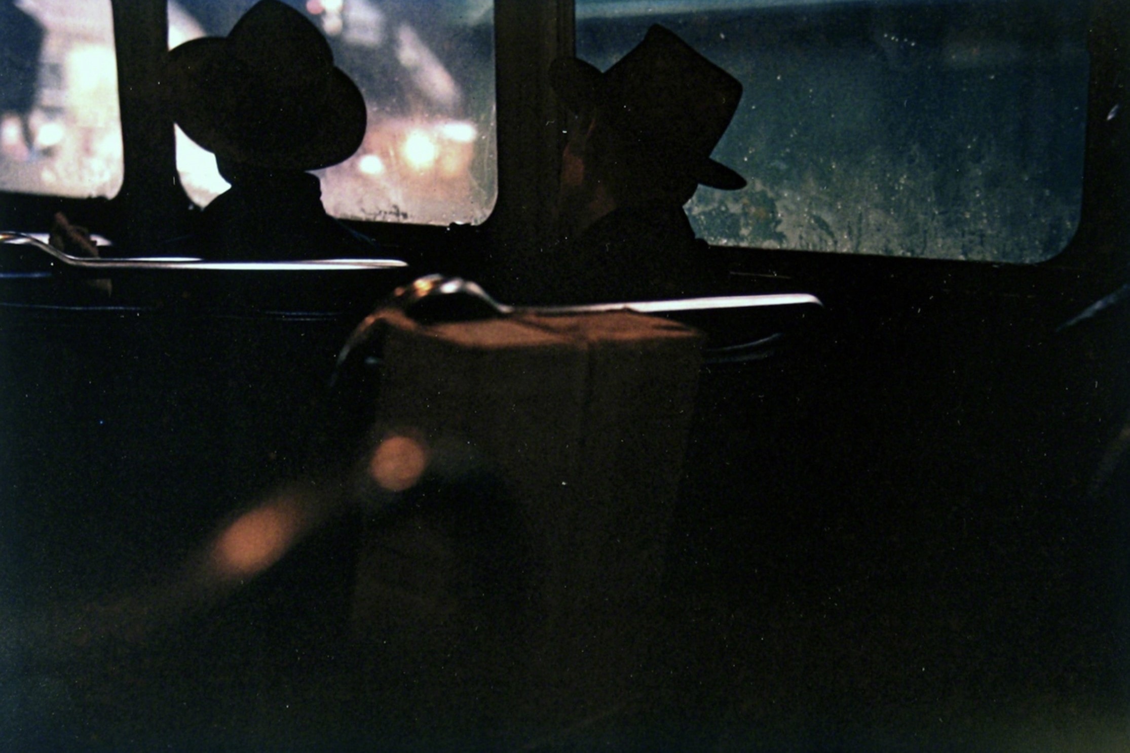 saul leiter, two men on the subway at night, new york city, 1951